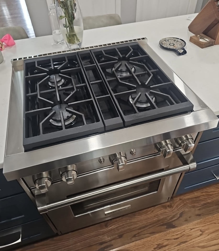 Modern stainless steel gas range in a kitchen